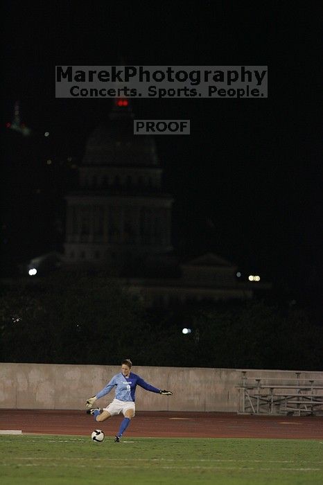 UT senior Dianna Pfenninger (#8, Goalkeeper) takes a goal kick with the capitol in the background.  The University of Texas women's soccer team tied 0-0 against the Texas A&M Aggies Friday night, September 27, 2008.

Filename: SRM_20080926_2050188.jpg
Aperture: f/2.8
Shutter Speed: 1/500
Body: Canon EOS-1D Mark II
Lens: Canon EF 300mm f/2.8 L IS