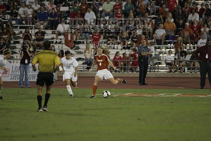 UT senior Jill Gilbeau (#4, Defender and Midfielder).  The University of Texas women's soccer team tied 0-0 against the Texas A&M Aggies Friday night, September 27, 2008.

Filename: SRM_20080926_2057180.jpg
Aperture: f/2.8
Shutter Speed: 1/640
Body: Canon EOS-1D Mark II
Lens: Canon EF 300mm f/2.8 L IS