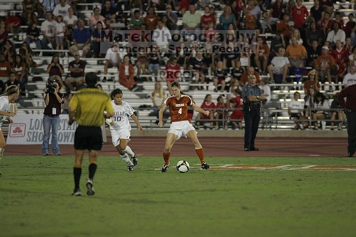 UT senior Jill Gilbeau (#4, Defender and Midfielder).  The University of Texas women's soccer team tied 0-0 against the Texas A&M Aggies Friday night, September 27, 2008.

Filename: SRM_20080926_2057181.jpg
Aperture: f/2.8
Shutter Speed: 1/640
Body: Canon EOS-1D Mark II
Lens: Canon EF 300mm f/2.8 L IS