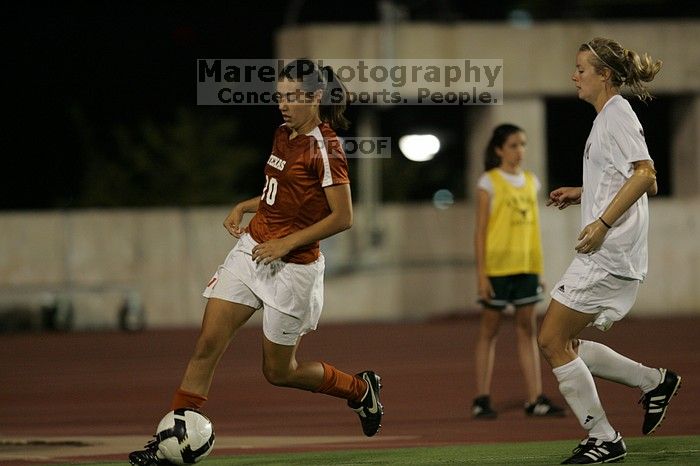 UT senior Stephanie Logterman (#10, Defender).  The University of Texas women's soccer team tied 0-0 against the Texas A&M Aggies Friday night, September 27, 2008.

Filename: SRM_20080926_2058046.jpg
Aperture: f/2.8
Shutter Speed: 1/640
Body: Canon EOS-1D Mark II
Lens: Canon EF 300mm f/2.8 L IS