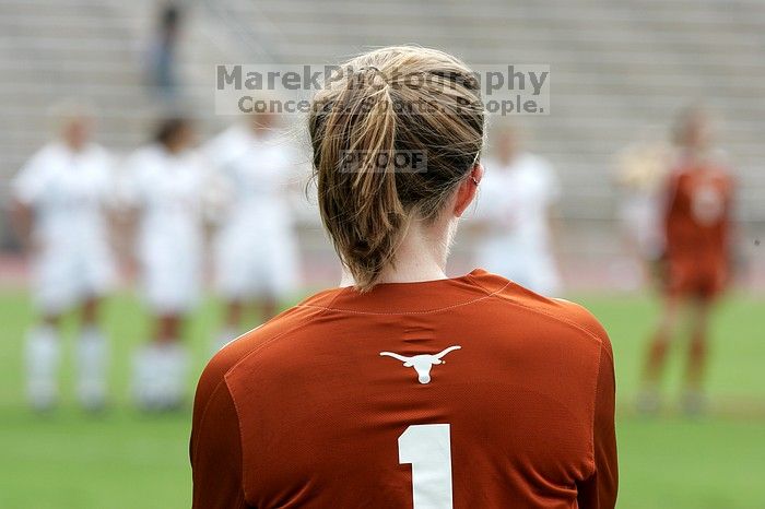 UT freshman Shaine Millheiser (#1, Goalkeeper) watches from the sideline as the starters line up on the field before the game.  The University of Texas women's soccer team won 2-1 against the Iowa State Cyclones Sunday afternoon, October 5, 2008.

Filename: SRM_20081005_11520041.jpg
Aperture: f/8.0
Shutter Speed: 1/640
Body: Canon EOS-1D Mark II
Lens: Canon EF 300mm f/2.8 L IS