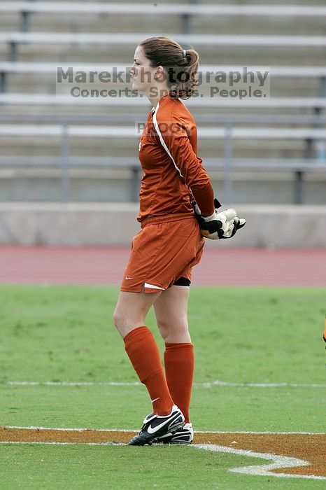 UT senior Dianna Pfenninger (#8, Goalkeeper) listens to the national anthem before the start of the game.  The University of Texas women's soccer team won 2-1 against the Iowa State Cyclones Sunday afternoon, October 5, 2008.

Filename: SRM_20081005_11543651.jpg
Aperture: f/8.0
Shutter Speed: 1/500
Body: Canon EOS-1D Mark II
Lens: Canon EF 300mm f/2.8 L IS