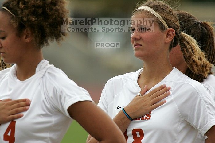 UT freshman Samantha Toner (#18, Midfielder) listens to the national anthem before the start of the game.  The University of Texas women's soccer team won 2-1 against the Iowa State Cyclones Sunday afternoon, October 5, 2008.

Filename: SRM_20081005_11550853.jpg
Aperture: f/8.0
Shutter Speed: 1/1000
Body: Canon EOS-1D Mark II
Lens: Canon EF 300mm f/2.8 L IS