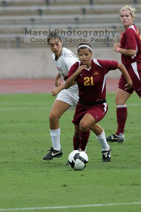 UT senior Stephanie Logterman (#10, Defender) plays defense on Iowa State #21.  The University of Texas women's soccer team won 2-1 against the Iowa State Cyclones Sunday afternoon, October 5, 2008.

Filename: SRM_20081005_11575673.jpg
Aperture: f/8.0
Shutter Speed: 1/640
Body: Canon EOS-1D Mark II
Lens: Canon EF 300mm f/2.8 L IS