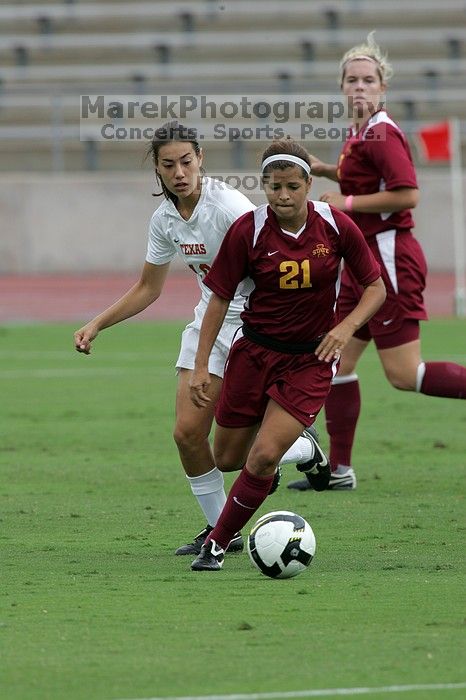 UT senior Stephanie Logterman (#10, Defender) plays defense on Iowa State #21.  The University of Texas women's soccer team won 2-1 against the Iowa State Cyclones Sunday afternoon, October 5, 2008.

Filename: SRM_20081005_11575674.jpg
Aperture: f/8.0
Shutter Speed: 1/800
Body: Canon EOS-1D Mark II
Lens: Canon EF 300mm f/2.8 L IS