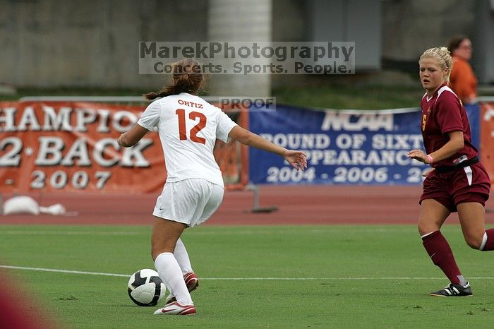 UT sophomore Alisha Ortiz (#12, Forward).  The University of Texas women's soccer team won 2-1 against the Iowa State Cyclones Sunday afternoon, October 5, 2008.

Filename: SRM_20081005_11594696.jpg
Aperture: f/8.0
Shutter Speed: 1/1000
Body: Canon EOS-1D Mark II
Lens: Canon EF 300mm f/2.8 L IS