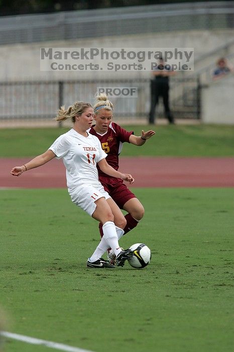 UT sophomore Niki Arlitt (#11, Forward) crosses the ball.  The University of Texas women's soccer team won 2-1 against the Iowa State Cyclones Sunday afternoon, October 5, 2008.

Filename: SRM_20081005_12014405.jpg
Aperture: f/5.6
Shutter Speed: 1/1600
Body: Canon EOS-1D Mark II
Lens: Canon EF 300mm f/2.8 L IS