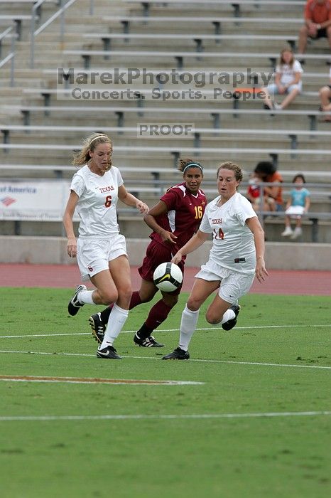 UT freshman Lucy Keith (#6, Midfielder) and UT senior Kasey Moore (#14, Defender) rush to the ball.  The University of Texas women's soccer team won 2-1 against the Iowa State Cyclones Sunday afternoon, October 5, 2008.

Filename: SRM_20081005_12022810.jpg
Aperture: f/5.6
Shutter Speed: 1/1250
Body: Canon EOS-1D Mark II
Lens: Canon EF 300mm f/2.8 L IS