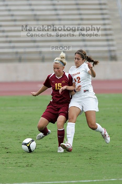 UT sophomore Alisha Ortiz (#12, Forward) fights for the ball.  The University of Texas women's soccer team won 2-1 against the Iowa State Cyclones Sunday afternoon, October 5, 2008.

Filename: SRM_20081005_12042233.jpg
Aperture: f/5.6
Shutter Speed: 1/1000
Body: Canon EOS-1D Mark II
Lens: Canon EF 300mm f/2.8 L IS