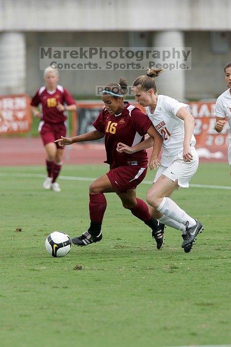 UT senior Stephanie Logterman (#10, Defender) and UT junior Emily Anderson (#21, Forward) team up on Iowa State #16.  The University of Texas women's soccer team won 2-1 against the Iowa State Cyclones Sunday afternoon, October 5, 2008.

Filename: SRM_20081005_12051646.jpg
Aperture: f/5.6
Shutter Speed: 1/1250
Body: Canon EOS-1D Mark II
Lens: Canon EF 300mm f/2.8 L IS