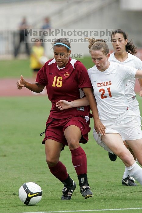 UT senior Stephanie Logterman (#10, Defender) and UT junior Emily Anderson (#21, Forward) team up on Iowa State #16.  The University of Texas women's soccer team won 2-1 against the Iowa State Cyclones Sunday afternoon, October 5, 2008.

Filename: SRM_20081005_12052061.jpg
Aperture: f/5.6
Shutter Speed: 1/1000
Body: Canon EOS-1D Mark II
Lens: Canon EF 300mm f/2.8 L IS