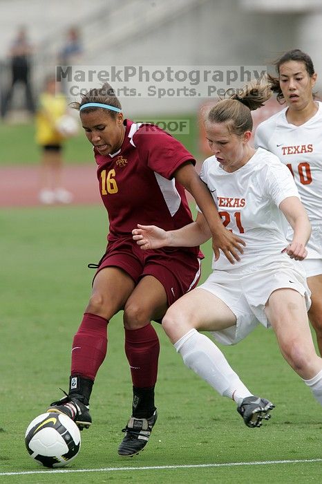 UT senior Stephanie Logterman (#10, Defender) and UT junior Emily Anderson (#21, Forward) team up on Iowa State #16.  The University of Texas women's soccer team won 2-1 against the Iowa State Cyclones Sunday afternoon, October 5, 2008.

Filename: SRM_20081005_12052263.jpg
Aperture: f/5.6
Shutter Speed: 1/1250
Body: Canon EOS-1D Mark II
Lens: Canon EF 300mm f/2.8 L IS