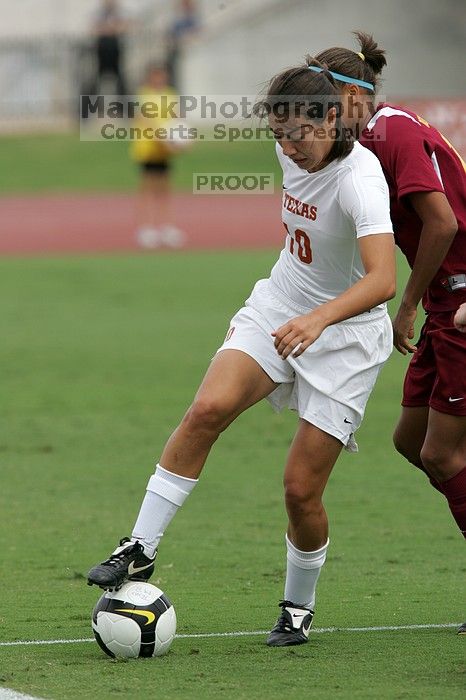 UT senior Stephanie Logterman (#10, Defender) and UT junior Emily Anderson (#21, Forward) team up on Iowa State #16.  The University of Texas women's soccer team won 2-1 against the Iowa State Cyclones Sunday afternoon, October 5, 2008.

Filename: SRM_20081005_12052470.jpg
Aperture: f/5.6
Shutter Speed: 1/1600
Body: Canon EOS-1D Mark II
Lens: Canon EF 300mm f/2.8 L IS