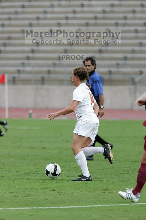 UT senior Kasey Moore (#14, Defender).  The University of Texas women's soccer team won 2-1 against the Iowa State Cyclones Sunday afternoon, October 5, 2008.

Filename: SRM_20081005_12082822.jpg
Aperture: f/5.6
Shutter Speed: 1/1250
Body: Canon EOS-1D Mark II
Lens: Canon EF 300mm f/2.8 L IS