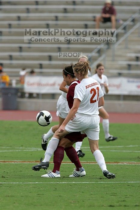 UT junior Emily Anderson (#21, Forward) plays defense.  The University of Texas women's soccer team won 2-1 against the Iowa State Cyclones Sunday afternoon, October 5, 2008.

Filename: SRM_20081005_12085026.jpg
Aperture: f/5.6
Shutter Speed: 1/1600
Body: Canon EOS-1D Mark II
Lens: Canon EF 300mm f/2.8 L IS