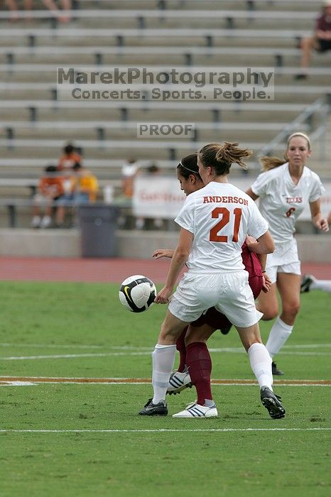 UT junior Emily Anderson (#21, Forward) plays defense.  The University of Texas women's soccer team won 2-1 against the Iowa State Cyclones Sunday afternoon, October 5, 2008.

Filename: SRM_20081005_12085027.jpg
Aperture: f/5.6
Shutter Speed: 1/1600
Body: Canon EOS-1D Mark II
Lens: Canon EF 300mm f/2.8 L IS