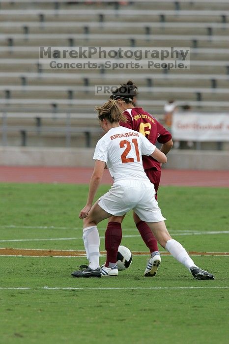 UT junior Emily Anderson (#21, Forward) plays defense.  The University of Texas women's soccer team won 2-1 against the Iowa State Cyclones Sunday afternoon, October 5, 2008.

Filename: SRM_20081005_12085028.jpg
Aperture: f/5.6
Shutter Speed: 1/1600
Body: Canon EOS-1D Mark II
Lens: Canon EF 300mm f/2.8 L IS