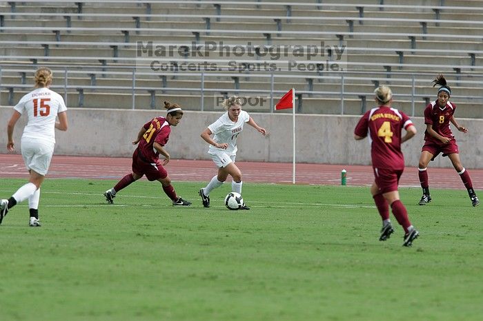 UT sophomore Niki Arlitt (#11, Forward) passes the ball to UT freshman Kylie Doniak (#15, Midfielder).  The University of Texas women's soccer team won 2-1 against the Iowa State Cyclones Sunday afternoon, October 5, 2008.

Filename: SRM_20081005_12095040.jpg
Aperture: f/5.6
Shutter Speed: 1/1600
Body: Canon EOS-1D Mark II
Lens: Canon EF 300mm f/2.8 L IS