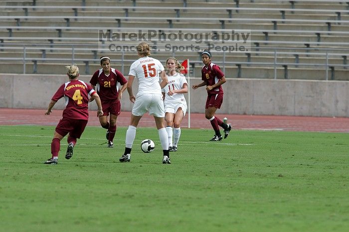 UT sophomore Niki Arlitt (#11, Forward) passes the ball to UT freshman Kylie Doniak (#15, Midfielder).  The University of Texas women's soccer team won 2-1 against the Iowa State Cyclones Sunday afternoon, October 5, 2008.

Filename: SRM_20081005_12095243.jpg
Aperture: f/5.6
Shutter Speed: 1/2000
Body: Canon EOS-1D Mark II
Lens: Canon EF 300mm f/2.8 L IS