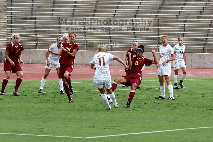 UT sophomore Niki Arlitt (#11, Forward) takes a shot on goal as UT freshman Courtney Goodson (#7, Forward and Midfielder), UT freshman Kylie Doniak (#15, Midfielder), and UT freshman Lucy Keith (#6, Midfielder) watch.  The University of Texas women's soccer team won 2-1 against the Iowa State Cyclones Sunday afternoon, October 5, 2008.

Filename: SRM_20081005_12104433.jpg
Aperture: f/5.6
Shutter Speed: 1/1250
Body: Canon EOS 20D
Lens: Canon EF 80-200mm f/2.8 L