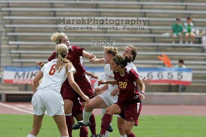 UT freshman Courtney Goodson (#7, Forward and Midfielder) and UT senior Kasey Moore (#14, Defender) await a header as UT freshman Lucy Keith (#6, Midfielder) watches.  The University of Texas women's soccer team won 2-1 against the Iowa State Cyclones Sunday afternoon, October 5, 2008.

Filename: SRM_20081005_12111845.jpg
Aperture: f/5.6
Shutter Speed: 1/2000
Body: Canon EOS-1D Mark II
Lens: Canon EF 300mm f/2.8 L IS