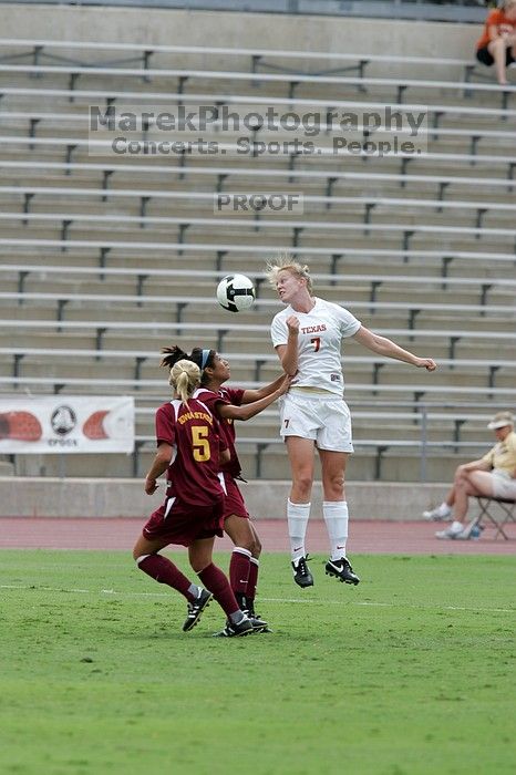 UT freshman Courtney Goodson (#7, Forward and Midfielder) heads the ball.  The University of Texas women's soccer team won 2-1 against the Iowa State Cyclones Sunday afternoon, October 5, 2008.

Filename: SRM_20081005_12115251.jpg
Aperture: f/5.6
Shutter Speed: 1/1600
Body: Canon EOS-1D Mark II
Lens: Canon EF 300mm f/2.8 L IS