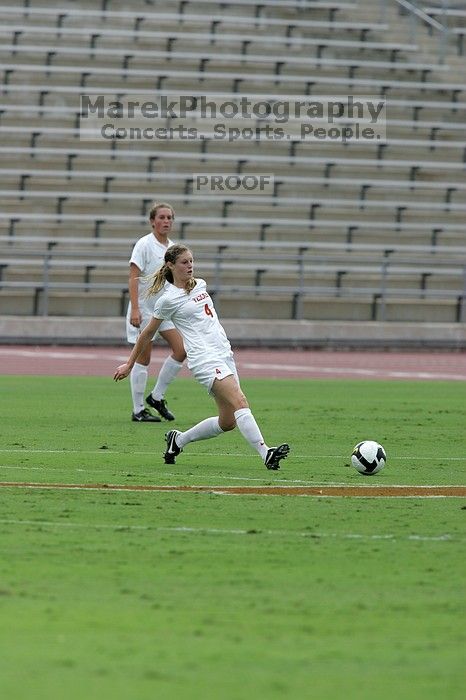 UT senior Jill Gilbeau (#4, Defender and Midfielder).  The University of Texas women's soccer team won 2-1 against the Iowa State Cyclones Sunday afternoon, October 5, 2008.

Filename: SRM_20081005_12120261.jpg
Aperture: f/5.6
Shutter Speed: 1/2000
Body: Canon EOS-1D Mark II
Lens: Canon EF 300mm f/2.8 L IS