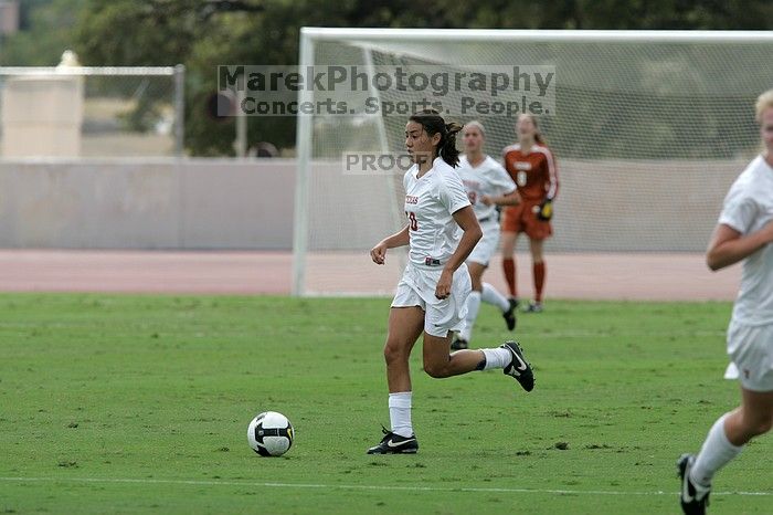 UT senior Stephanie Logterman (#10, Defender).  The University of Texas women's soccer team won 2-1 against the Iowa State Cyclones Sunday afternoon, October 5, 2008.

Filename: SRM_20081005_12123082.jpg
Aperture: f/5.6
Shutter Speed: 1/2000
Body: Canon EOS-1D Mark II
Lens: Canon EF 300mm f/2.8 L IS