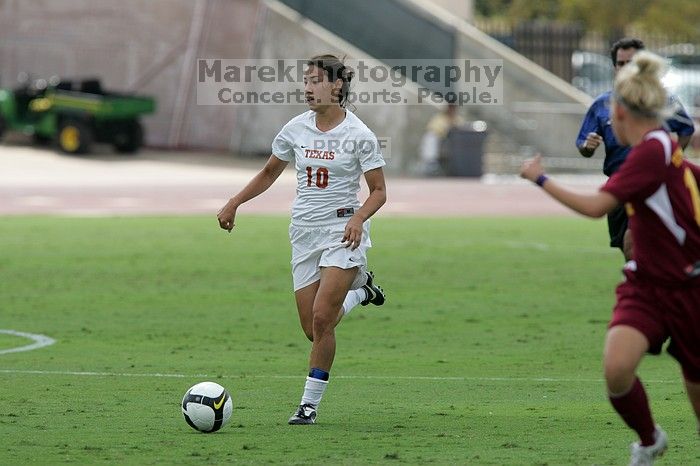 UT senior Stephanie Logterman (#10, Defender).  The University of Texas women's soccer team won 2-1 against the Iowa State Cyclones Sunday afternoon, October 5, 2008.

Filename: SRM_20081005_12123289.jpg
Aperture: f/5.6
Shutter Speed: 1/1600
Body: Canon EOS-1D Mark II
Lens: Canon EF 300mm f/2.8 L IS