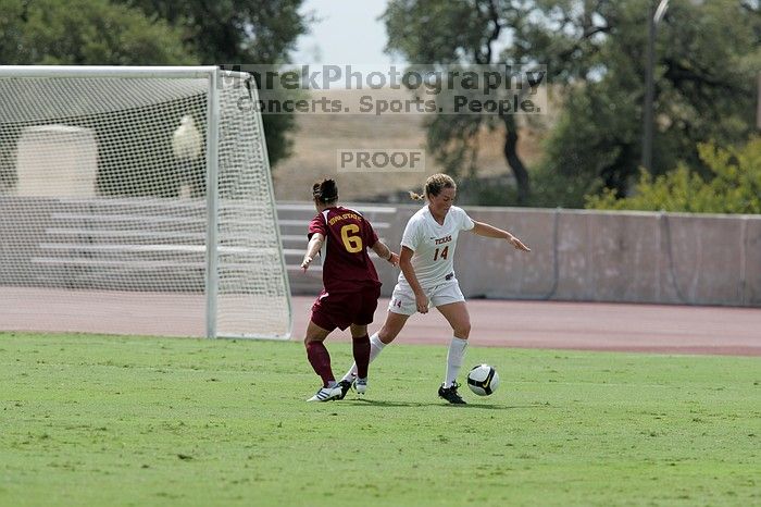 UT senior Kasey Moore (#14, Defender) prevents a shot on goal.  The University of Texas women's soccer team won 2-1 against the Iowa State Cyclones Sunday afternoon, October 5, 2008.

Filename: SRM_20081005_12141807.jpg
Aperture: f/5.6
Shutter Speed: 1/2000
Body: Canon EOS-1D Mark II
Lens: Canon EF 300mm f/2.8 L IS