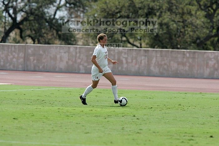 UT senior Kasey Moore (#14, Defender).  The University of Texas women's soccer team won 2-1 against the Iowa State Cyclones Sunday afternoon, October 5, 2008.

Filename: SRM_20081005_12142008.jpg
Aperture: f/5.6
Shutter Speed: 1/2000
Body: Canon EOS-1D Mark II
Lens: Canon EF 300mm f/2.8 L IS