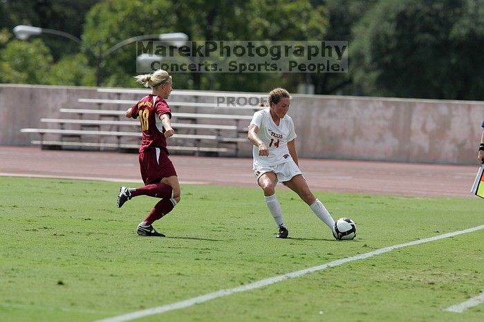 UT senior Kasey Moore (#14, Defender).  The University of Texas women's soccer team won 2-1 against the Iowa State Cyclones Sunday afternoon, October 5, 2008.

Filename: SRM_20081005_12142210.jpg
Aperture: f/5.6
Shutter Speed: 1/2500
Body: Canon EOS-1D Mark II
Lens: Canon EF 300mm f/2.8 L IS