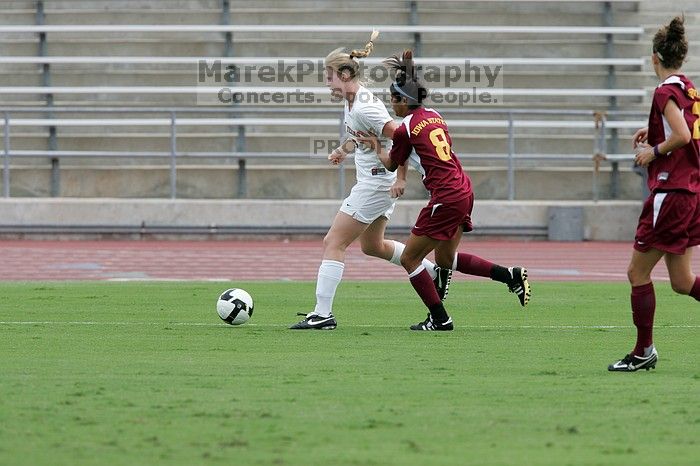 UT freshman Courtney Goodson (#7, Forward and Midfielder) takes the ball down the sideline.  The University of Texas women's soccer team won 2-1 against the Iowa State Cyclones Sunday afternoon, October 5, 2008.

Filename: SRM_20081005_12153219.jpg
Aperture: f/5.6
Shutter Speed: 1/1000
Body: Canon EOS-1D Mark II
Lens: Canon EF 300mm f/2.8 L IS