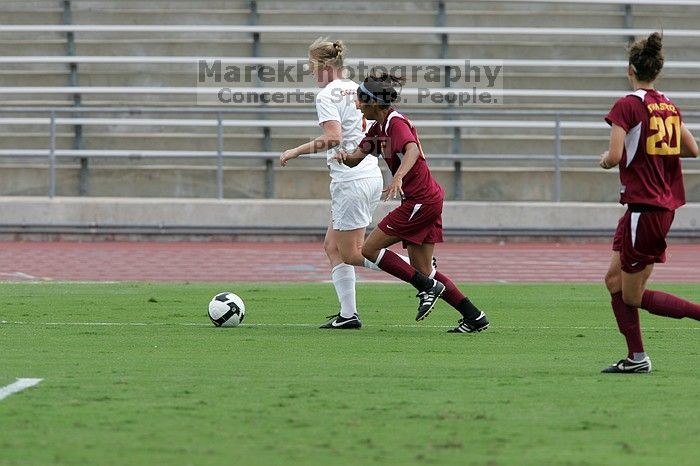 UT freshman Courtney Goodson (#7, Forward and Midfielder) takes the ball down the sideline.  The University of Texas women's soccer team won 2-1 against the Iowa State Cyclones Sunday afternoon, October 5, 2008.

Filename: SRM_20081005_12153222.jpg
Aperture: f/5.6
Shutter Speed: 1/1250
Body: Canon EOS-1D Mark II
Lens: Canon EF 300mm f/2.8 L IS