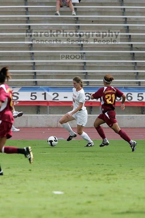 UT senior Jill Gilbeau (#4, Defender and Midfielder).  The University of Texas women's soccer team won 2-1 against the Iowa State Cyclones Sunday afternoon, October 5, 2008.

Filename: SRM_20081005_12172441.jpg
Aperture: f/5.6
Shutter Speed: 1/1600
Body: Canon EOS-1D Mark II
Lens: Canon EF 300mm f/2.8 L IS