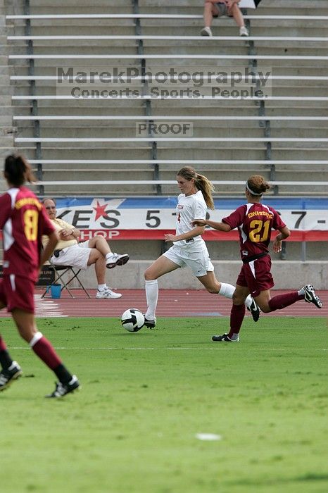 UT senior Jill Gilbeau (#4, Defender and Midfielder).  The University of Texas women's soccer team won 2-1 against the Iowa State Cyclones Sunday afternoon, October 5, 2008.

Filename: SRM_20081005_12172642.jpg
Aperture: f/5.6
Shutter Speed: 1/1600
Body: Canon EOS-1D Mark II
Lens: Canon EF 300mm f/2.8 L IS