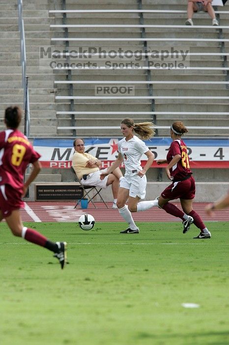 UT senior Jill Gilbeau (#4, Defender and Midfielder).  The University of Texas women's soccer team won 2-1 against the Iowa State Cyclones Sunday afternoon, October 5, 2008.

Filename: SRM_20081005_12172643.jpg
Aperture: f/5.6
Shutter Speed: 1/1600
Body: Canon EOS-1D Mark II
Lens: Canon EF 300mm f/2.8 L IS