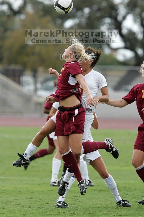 UT senior Stephanie Logterman (#10, Defender) fights for the header with Iowa State #18 as UT sophomore Niki Arlitt (#11, Forward) watches.  The University of Texas women's soccer team won 2-1 against the Iowa State Cyclones Sunday afternoon, October 5, 2008.

Filename: SRM_20081005_12182048.jpg
Aperture: f/5.6
Shutter Speed: 1/1000
Body: Canon EOS-1D Mark II
Lens: Canon EF 300mm f/2.8 L IS