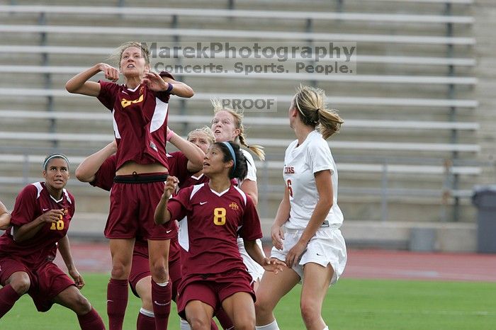 UT freshman Courtney Goodson (#7, Forward and Midfielder) attempts a header while UT senior Kasey Moore (#14, Defender) and UT freshman Lucy Keith (#6, Midfielder) watch.  The University of Texas women's soccer team won 2-1 against the Iowa State Cyclones Sunday afternoon, October 5, 2008.

Filename: SRM_20081005_12235031.jpg
Aperture: f/5.6
Shutter Speed: 1/1000
Body: Canon EOS-1D Mark II
Lens: Canon EF 300mm f/2.8 L IS