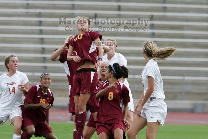 UT freshman Courtney Goodson (#7, Forward and Midfielder) attempts a header while UT senior Kasey Moore (#14, Defender) and UT freshman Lucy Keith (#6, Midfielder) watch.  The University of Texas women's soccer team won 2-1 against the Iowa State Cyclones Sunday afternoon, October 5, 2008.

Filename: SRM_20081005_12235032.jpg
Aperture: f/5.6
Shutter Speed: 1/1000
Body: Canon EOS-1D Mark II
Lens: Canon EF 300mm f/2.8 L IS