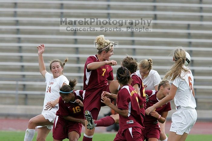 UT freshman Courtney Goodson (#7, Forward and Midfielder) attempts a header while UT senior Kasey Moore (#14, Defender) and UT freshman Lucy Keith (#6, Midfielder) watch.  The University of Texas women's soccer team won 2-1 against the Iowa State Cyclones Sunday afternoon, October 5, 2008.

Filename: SRM_20081005_12235035.jpg
Aperture: f/5.6
Shutter Speed: 1/1000
Body: Canon EOS-1D Mark II
Lens: Canon EF 300mm f/2.8 L IS