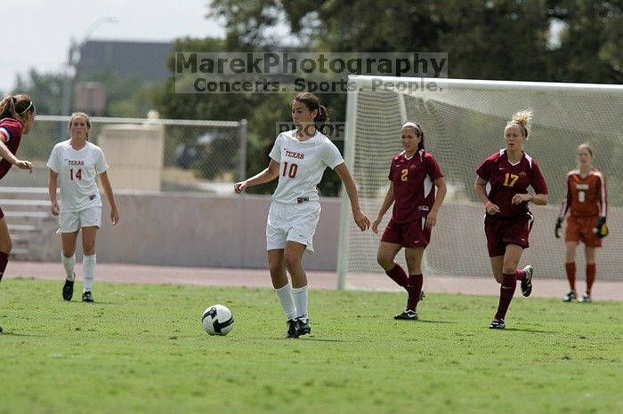 UT senior Stephanie Logterman (#10, Defender) passes the ball to UT sophomore Niki Arlitt (#11, Forward).  The University of Texas women's soccer team won 2-1 against the Iowa State Cyclones Sunday afternoon, October 5, 2008.

Filename: SRM_20081005_12303688.jpg
Aperture: f/5.6
Shutter Speed: 1/2500
Body: Canon EOS-1D Mark II
Lens: Canon EF 300mm f/2.8 L IS