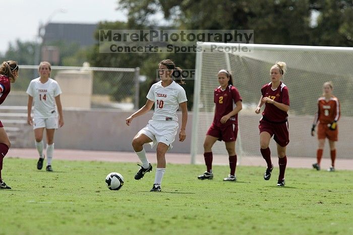 UT senior Stephanie Logterman (#10, Defender) passes the ball to UT sophomore Niki Arlitt (#11, Forward).  The University of Texas women's soccer team won 2-1 against the Iowa State Cyclones Sunday afternoon, October 5, 2008.

Filename: SRM_20081005_12303689.jpg
Aperture: f/5.6
Shutter Speed: 1/2000
Body: Canon EOS-1D Mark II
Lens: Canon EF 300mm f/2.8 L IS