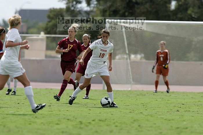 UT senior Stephanie Logterman (#10, Defender) passes the ball to UT sophomore Niki Arlitt (#11, Forward).  The University of Texas women's soccer team won 2-1 against the Iowa State Cyclones Sunday afternoon, October 5, 2008.

Filename: SRM_20081005_12303692.jpg
Aperture: f/5.6
Shutter Speed: 1/2000
Body: Canon EOS-1D Mark II
Lens: Canon EF 300mm f/2.8 L IS