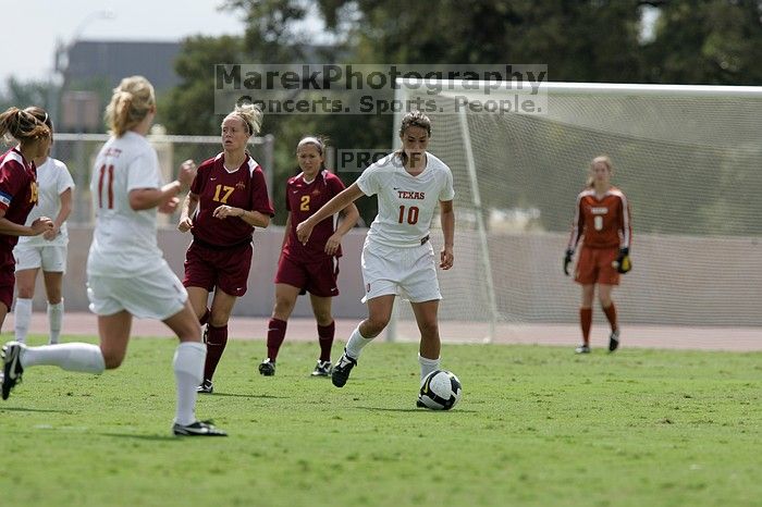 UT senior Stephanie Logterman (#10, Defender) passes the ball to UT sophomore Niki Arlitt (#11, Forward).  The University of Texas women's soccer team won 2-1 against the Iowa State Cyclones Sunday afternoon, October 5, 2008.

Filename: SRM_20081005_12303893.jpg
Aperture: f/5.6
Shutter Speed: 1/2500
Body: Canon EOS-1D Mark II
Lens: Canon EF 300mm f/2.8 L IS