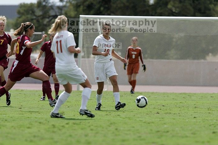 UT senior Stephanie Logterman (#10, Defender) passes the ball to UT sophomore Niki Arlitt (#11, Forward).  The University of Texas women's soccer team won 2-1 against the Iowa State Cyclones Sunday afternoon, October 5, 2008.

Filename: SRM_20081005_12303894.jpg
Aperture: f/5.6
Shutter Speed: 1/2000
Body: Canon EOS-1D Mark II
Lens: Canon EF 300mm f/2.8 L IS