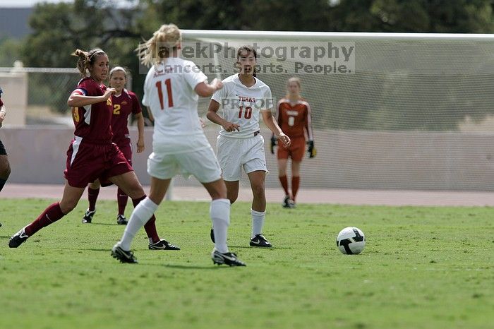 UT senior Stephanie Logterman (#10, Defender) passes the ball to UT sophomore Niki Arlitt (#11, Forward).  The University of Texas women's soccer team won 2-1 against the Iowa State Cyclones Sunday afternoon, October 5, 2008.

Filename: SRM_20081005_12303895.jpg
Aperture: f/5.6
Shutter Speed: 1/2500
Body: Canon EOS-1D Mark II
Lens: Canon EF 300mm f/2.8 L IS