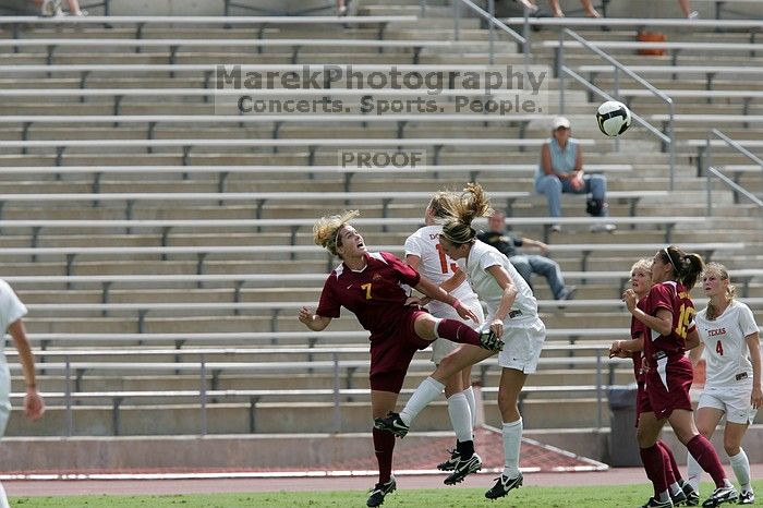 UT freshman Lucy Keith (#6, Midfielder) fights for the header as UT senior Jill Gilbeau (#4, Defender and Midfielder) watches.  The University of Texas women's soccer team won 2-1 against the Iowa State Cyclones Sunday afternoon, October 5, 2008.

Filename: SRM_20081005_12313800.jpg
Aperture: f/5.6
Shutter Speed: 1/2000
Body: Canon EOS-1D Mark II
Lens: Canon EF 300mm f/2.8 L IS