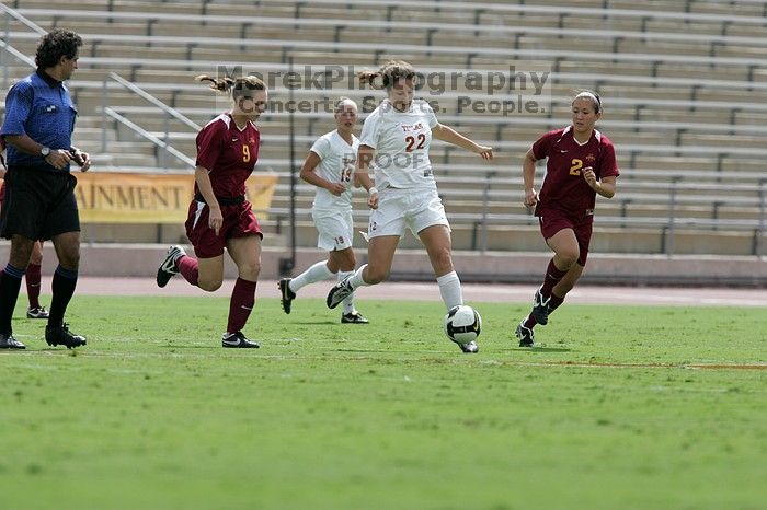 UT junior Stephanie Gibson (#22, Defense and Forward) passes the ball.  The University of Texas women's soccer team won 2-1 against the Iowa State Cyclones Sunday afternoon, October 5, 2008.

Filename: SRM_20081005_12314005.jpg
Aperture: f/5.6
Shutter Speed: 1/2500
Body: Canon EOS-1D Mark II
Lens: Canon EF 300mm f/2.8 L IS