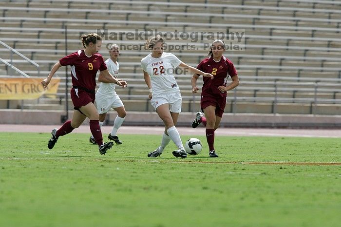 UT junior Stephanie Gibson (#22, Defense and Forward) passes the ball.  The University of Texas women's soccer team won 2-1 against the Iowa State Cyclones Sunday afternoon, October 5, 2008.

Filename: SRM_20081005_12314006.jpg
Aperture: f/5.6
Shutter Speed: 1/2500
Body: Canon EOS-1D Mark II
Lens: Canon EF 300mm f/2.8 L IS